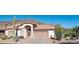 Charming single-story home with desert landscaping and golf course views in the background at 5023 S Dusty Coyote Trl, Gold Canyon, AZ 85118