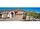 Charming single-story home featuring desert landscaping, a two-car garage, and a backdrop of beautiful mountain views at 5023 S Dusty Coyote Trl, Gold Canyon, AZ 85118