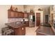 Modern kitchen features granite countertops, stainless steel appliances, and custom cabinetry offering both style and functionality at 5023 S Dusty Coyote Trl, Gold Canyon, AZ 85118