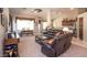Comfortable living room showcasing modern decor, a cozy seating area, and seamless connection to other living spaces at 5023 S Dusty Coyote Trl, Gold Canyon, AZ 85118