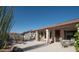 Covered patio with desert landscaping and an outdoor seating area at 5023 S Dusty Coyote Trl, Gold Canyon, AZ 85118