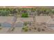 Aerial view of a single-story home with a tile roof, desert landscaping, and a two-car garage at 5283 W Dublin Ct, Chandler, AZ 85226