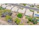 Aerial view shows lush trees surrounding properties with patio covers at 5283 W Dublin Ct, Chandler, AZ 85226
