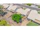 Aerial view of property featuring a lush tree, desert landscaping, and a trampoline at 5283 W Dublin Ct, Chandler, AZ 85226