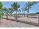 Property line featuring a decorative brick and metal fence and mature landscaping at 5283 W Dublin Ct, Chandler, AZ 85226
