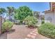Spacious backyard showcasing a lush lawn, mature trees, and a patio area, perfect for outdoor gatherings at 5283 W Dublin Ct, Chandler, AZ 85226
