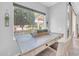 Cozy dining area bathed in natural light from a large window, creating a warm and inviting space at 5283 W Dublin Ct, Chandler, AZ 85226