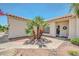 The front entrance features decorative door wreath and desert landscaping with a palm tree at 5283 W Dublin Ct, Chandler, AZ 85226