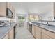 Well-appointed kitchen with plenty of counter space and cabinetry, adjacent to a bright dining area at 5283 W Dublin Ct, Chandler, AZ 85226