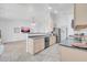 Open-concept kitchen boasts stainless steel appliances, ample cabinetry, and seamless flow to the living area at 5283 W Dublin Ct, Chandler, AZ 85226