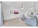 Spacious living room with modern decor, tile flooring, and a large TV for entertaining at 5283 W Dublin Ct, Chandler, AZ 85226