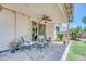 Relaxing covered patio with comfortable seating, ceiling fan, and sliding doors to the interior at 5283 W Dublin Ct, Chandler, AZ 85226