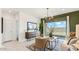 Living room features backyard access, an accent wall, and neutral tile floors at 5457 E Mearn Rd, San Tan Valley, AZ 85140