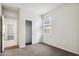 Bright bedroom with closet and window at 5575 E Mearn Rd, San Tan Valley, AZ 85140