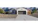 Charming single-story home showcasing desert landscaping and a spacious two-car garage at 5575 E Mearn Rd, San Tan Valley, AZ 85140