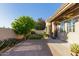 Paver patio backyard featuring a lush citrus tree and plenty of greenery, ideal for outdoor living at 6202 E Mckellips Rd # 25, Mesa, AZ 85215