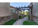 Inviting entrance with stone accents, a decorative pergola, and a beautifully paved walkway at 6202 E Mckellips Rd # 25, Mesa, AZ 85215