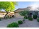 Inviting home exterior features a two-car garage and manicured landscaping for great curb appeal at 6202 E Mckellips Rd # 25, Mesa, AZ 85215