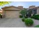 Inviting home exterior features a two-car garage and manicured landscaping for great curb appeal at 6202 E Mckellips Rd # 25, Mesa, AZ 85215