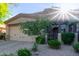 Inviting home exterior features a two-car garage and manicured landscaping for great curb appeal at 6202 E Mckellips Rd # 25, Mesa, AZ 85215