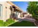 Charming covered outdoor area with decorative stone pillars and lush landscaping, creating a welcoming exterior at 6202 E Mckellips Rd # 25, Mesa, AZ 85215