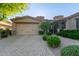Inviting home exterior features a two-car garage and manicured landscaping for great curb appeal at 6202 E Mckellips Rd # 25, Mesa, AZ 85215