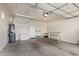 Spacious garage with ample storage, including overhead racks and shelving, perfect for organization at 6202 E Mckellips Rd # 25, Mesa, AZ 85215