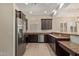 Modern kitchen with stainless steel appliances, granite countertops, and ample cabinet space at 6202 E Mckellips Rd # 25, Mesa, AZ 85215