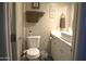 Neat bathroom featuring a toilet, sink and vanity with storage at 6885 E Cochise Rd # 127, Paradise Valley, AZ 85253