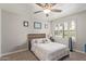 Cozy bedroom with a ceiling fan, a wood accent headboard, and shutters at 6885 E Cochise Rd # 127, Paradise Valley, AZ 85253