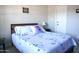 Cozy bedroom with a queen size bed, side table and decorative accents at 6885 E Cochise Rd # 127, Paradise Valley, AZ 85253