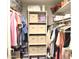 Organized closet with shelves, hanging space, and storage containers at 6885 E Cochise Rd # 127, Paradise Valley, AZ 85253