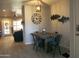 Cozy dining area with wooden table, metal chairs, and decorative clock at 6885 E Cochise Rd # 127, Paradise Valley, AZ 85253