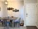 Dining area featuring a wooden table with blue cushioned metal chairs at 6885 E Cochise Rd # 127, Paradise Valley, AZ 85253