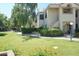 Well-maintained condo building with lush landscaping and manicured lawns at 6885 E Cochise Rd # 127, Paradise Valley, AZ 85253