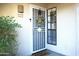 Charming front door with decorative wreath and a 'Wipe Your Paws' welcome mat at 6885 E Cochise Rd # 127, Paradise Valley, AZ 85253