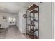 Open hallway with decor shelving, neutral paint, and tile flooring at 6885 E Cochise Rd # 127, Paradise Valley, AZ 85253