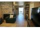 Comfortable living room with fireplace and tile floors leading to the kitchen at 6885 E Cochise Rd # 127, Paradise Valley, AZ 85253