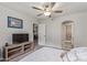 Main bedroom with a TV and doorway to a bathroom at 6885 E Cochise Rd # 127, Paradise Valley, AZ 85253