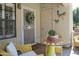 Relaxing patio with yellow wicker furniture and a glass table at 6885 E Cochise Rd # 127, Paradise Valley, AZ 85253