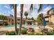 Community pool with lounge chairs and a shaded pavilion surrounded by lush landscaping at 6885 E Cochise Rd # 127, Paradise Valley, AZ 85253