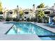 Community pool featuring lounge chairs and well maintained landscaping at residential apartments at 6885 E Cochise Rd # 127, Paradise Valley, AZ 85253