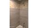 Clean tiled shower with gray tiles and a shower head at 6885 E Cochise Rd # 127, Paradise Valley, AZ 85253