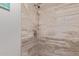 Walk-in shower with tile walls and flooring, featuring contemporary hardware and design at 6885 E Cochise Rd # 127, Paradise Valley, AZ 85253