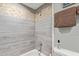 Modern shower features decorative tile accents and contemporary fixtures at 6885 E Cochise Rd # 127, Paradise Valley, AZ 85253