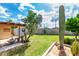 Spacious backyard with desert landscaping, including cacti and a charming water feature at 6902 E Cypress St, Scottsdale, AZ 85257