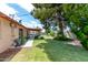 Lush backyard with a covered patio and mature trees offering privacy at 6902 E Cypress St, Scottsdale, AZ 85257
