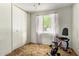 Bright bedroom with natural light, closet, and exercise bike at 6902 E Cypress St, Scottsdale, AZ 85257