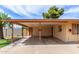 Attached carport provides covered parking and protection, with a door leading to the main house and storage options at 6902 E Cypress St, Scottsdale, AZ 85257