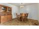 Cozy dining room features a wooden table set and a vintage china cabinet at 6902 E Cypress St, Scottsdale, AZ 85257